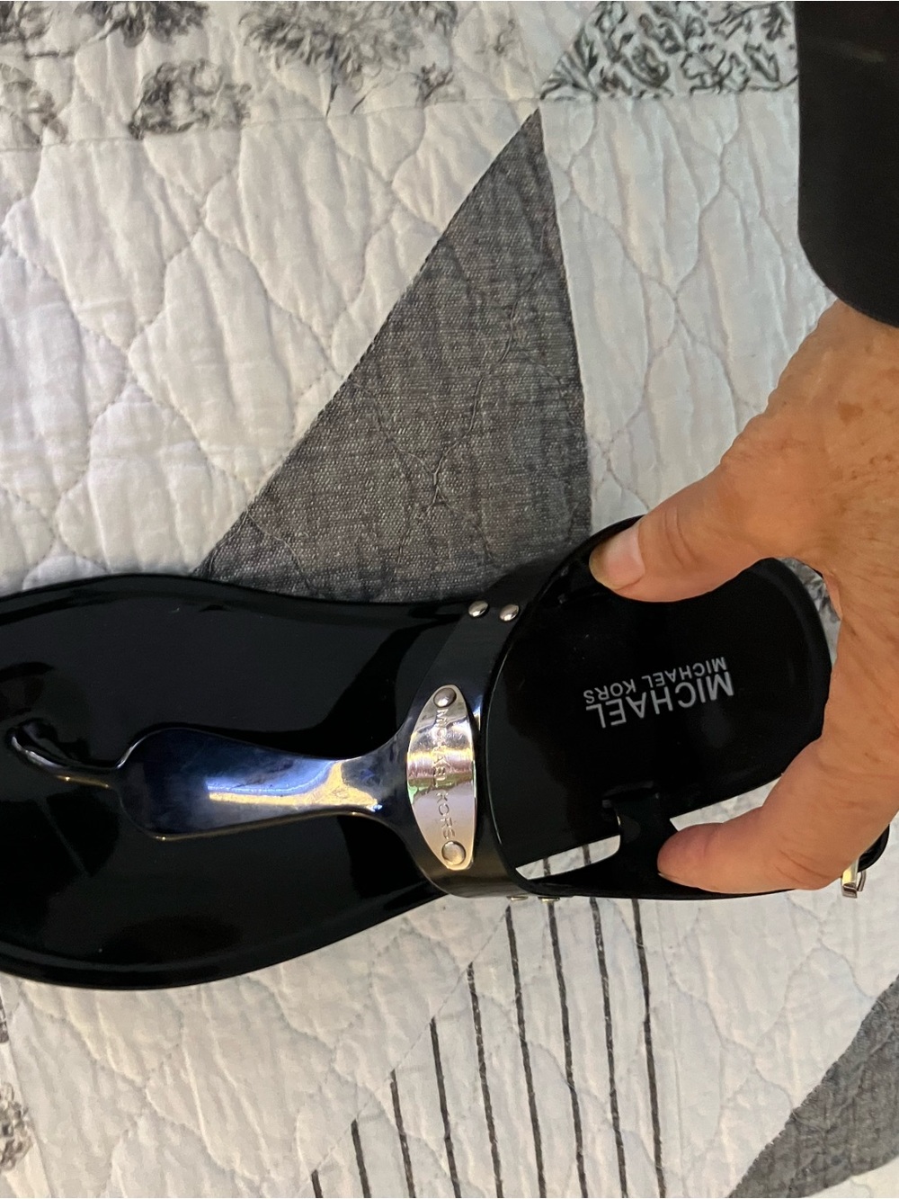 MICHAEL KORS Black Patent Jelly Thong Sandal with Silver Logo Plate
